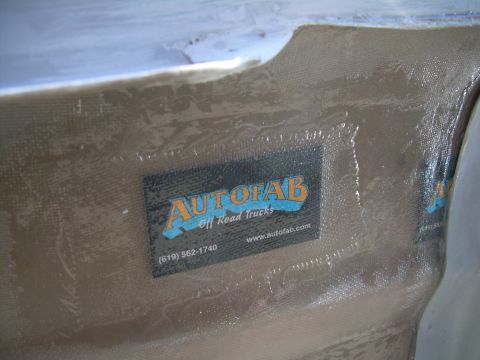 1986 Ford Bronco - Autofab Off Road Trucks sticker is affixed to a fiberglass part, showing contact information.
