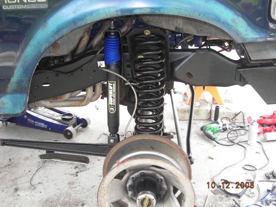 1993 Ford Bronco front suspension with new Superlift shock and coil spring, wheel removed