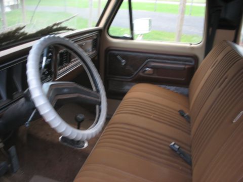 1978 Ford F-250 - Interior view of a 1978 Ford F-250, showing the bench seat, dashboard, and steering wheel.