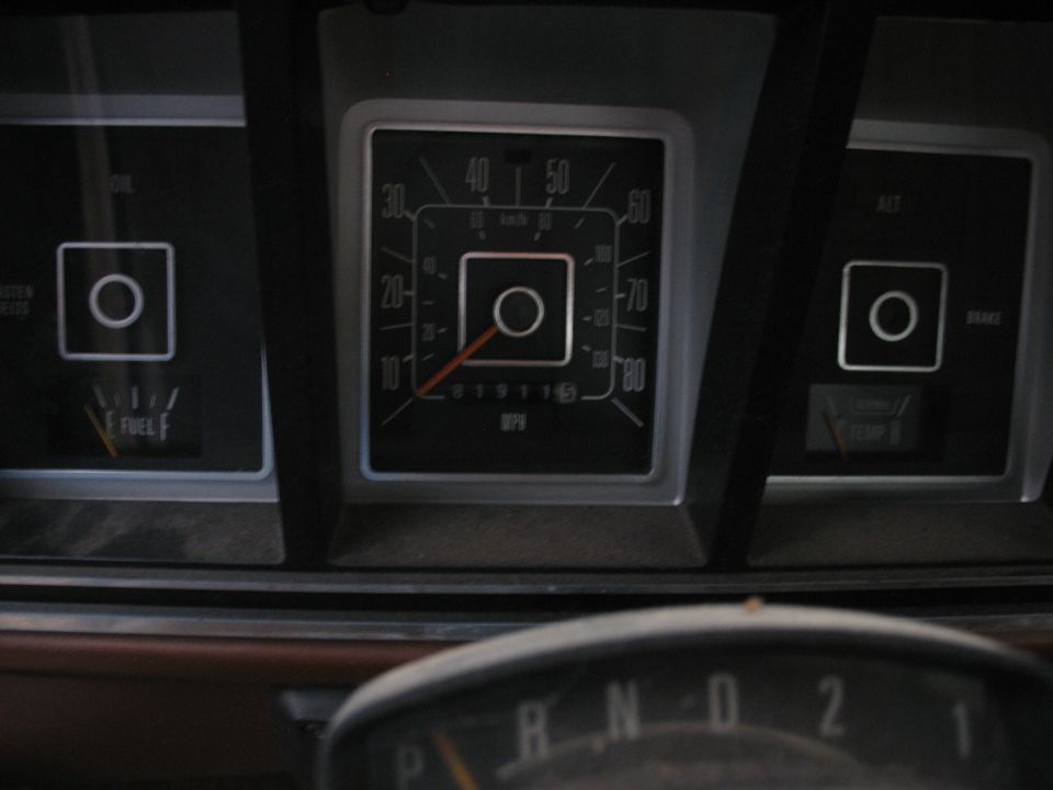 1978 Ford F-250 dashboard with speedometer, fuel gauge, oil pressure light, and temperature gauge