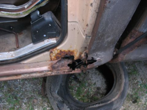 1978 Ford F-250 - Door sill rust on a vehicle, showing extensive corrosion and damage.