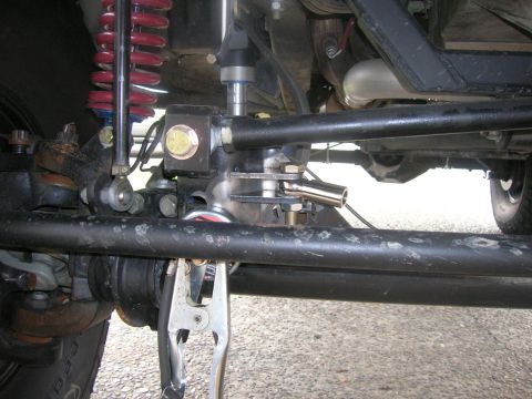 1996 Ford Bronco - Undercarriage view of steering linkage and suspension parts.