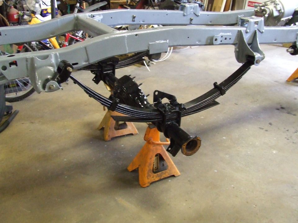 Vehicle frame with rear axle and leaf springs on jack stands
