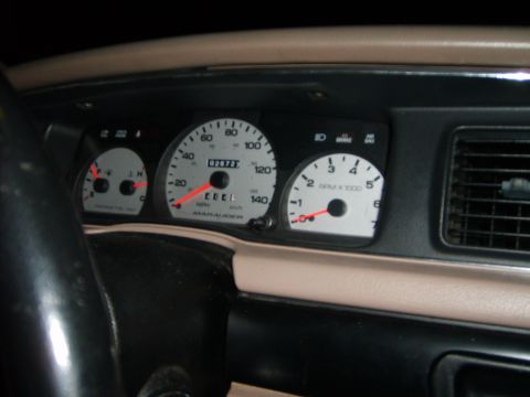 1993 Ford Crown Victoria - The interior of a car's dashboard is shown, featuring a speedometer, tachometer, and fuel gauge. The odometer displays "026727" and the spe…