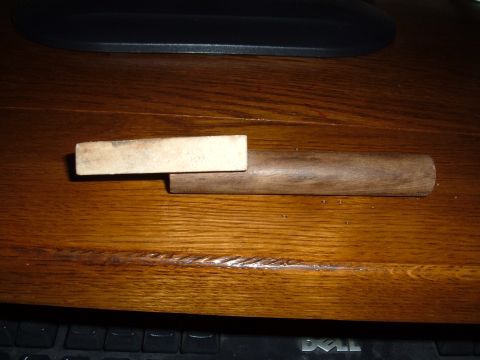 1998 BMW R1100GS ABS - A wooden dowel and block assembly is shown on a wooden desk surface.