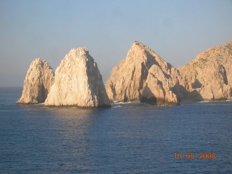 1985 Ford Bronco - Iconic rock formations at Land's End in Cabo San Lucas stand against the vast blue ocean.