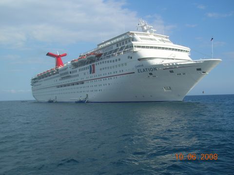 1985 Ford Bronco - The Carnival Elation cruise ship is seen from the water on a clear day.