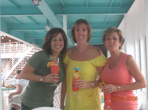 1985 Ford Bronco - Three women enjoy drinks on a deck, with a date stamp visible on the right.