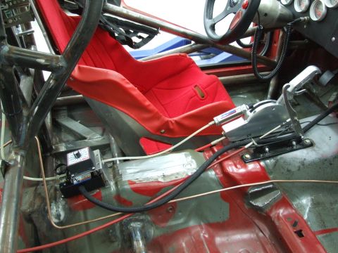 1990 Ford Mustang - Interior view of a modified vehicle, likely for racing, with custom controls and safety features.