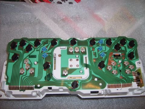 1993 Ford Crown Victoria - The intricate circuitry of a vehicle's instrument cluster is visible, showing a complex arrangement of components and connections.
