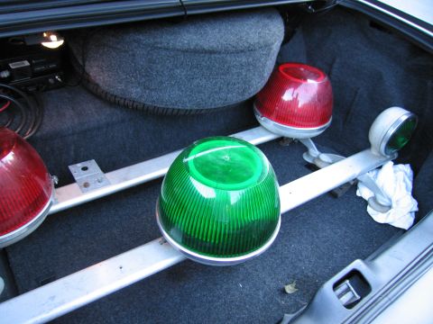 2001 Ford Crown Victoria - Emergency lights and spare tire visible in the trunk of a car.