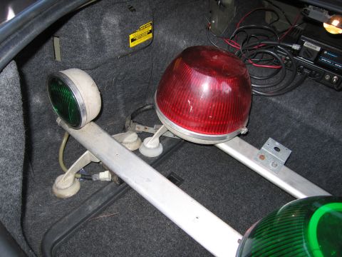 2001 Ford Crown Victoria - Emergency lights and radio equipment are stored in the trunk of a car.