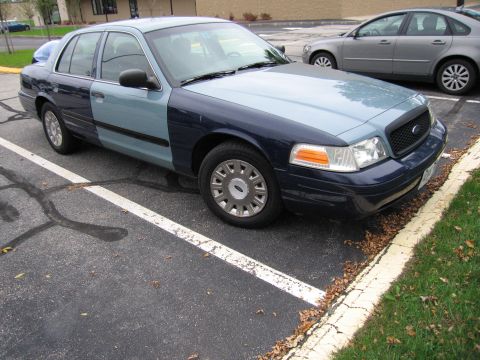 2001 Ford Crown Victoria - This 2001 Ford Crown Victoria has a two-tone paint job with a dark blue front and a lighter blue rear section.