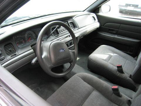 2001 Ford Crown Victoria - Interior view of a 2001 Ford Crown Victoria, the dashboard and front seating area.