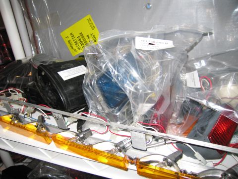 2001 Ford Crown Victoria - Various vehicle lighting components are stored together in plastic packaging.