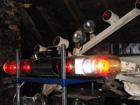 2001 Ford Crown Victoria - A collection of emergency lights and spotlights are visible, possibly from a decommissioned vehicle.