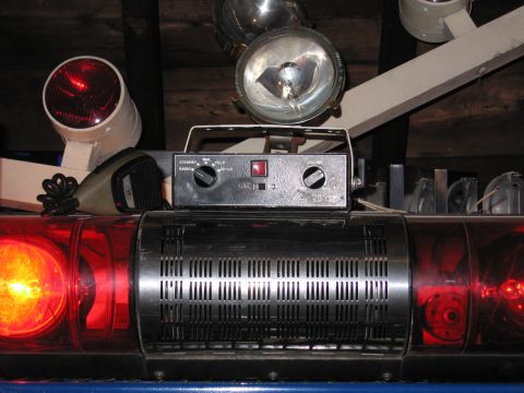 2001 Ford Crown Victoria - Close-up of an emergency light bar, control box, and microphone, likely from a police or emergency vehicle.