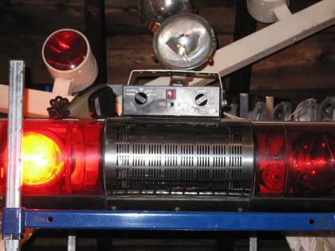 2001 Ford Crown Victoria - Close-up of an emergency light bar and its control unit, likely for a vehicle.