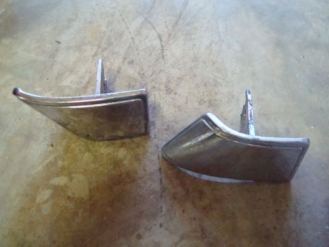 1995 Ford Bronco - Two chrome door handles are shown against a concrete background.