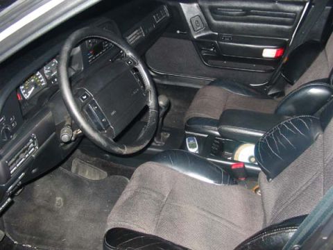 1990 Ford Taurus - Interior view of a 1990 Ford Taurus, showing the dashboard, steering wheel, and seating.