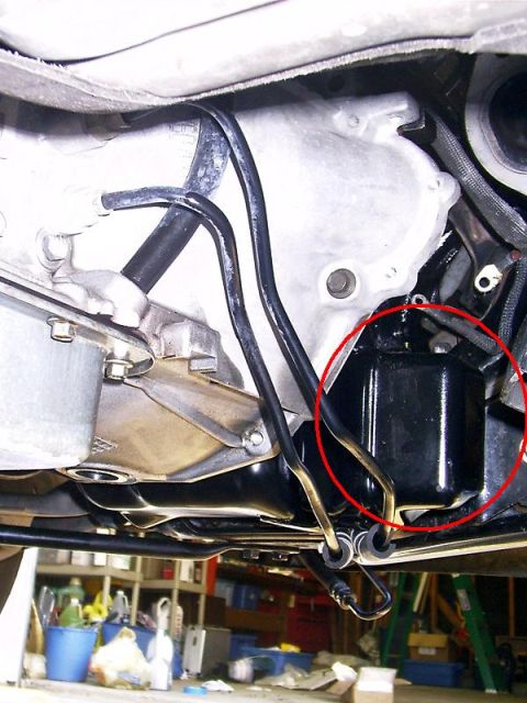 2000 Ford Crown Victoria - Underside view of a vehicle's engine bay, highlighting the oil filter.