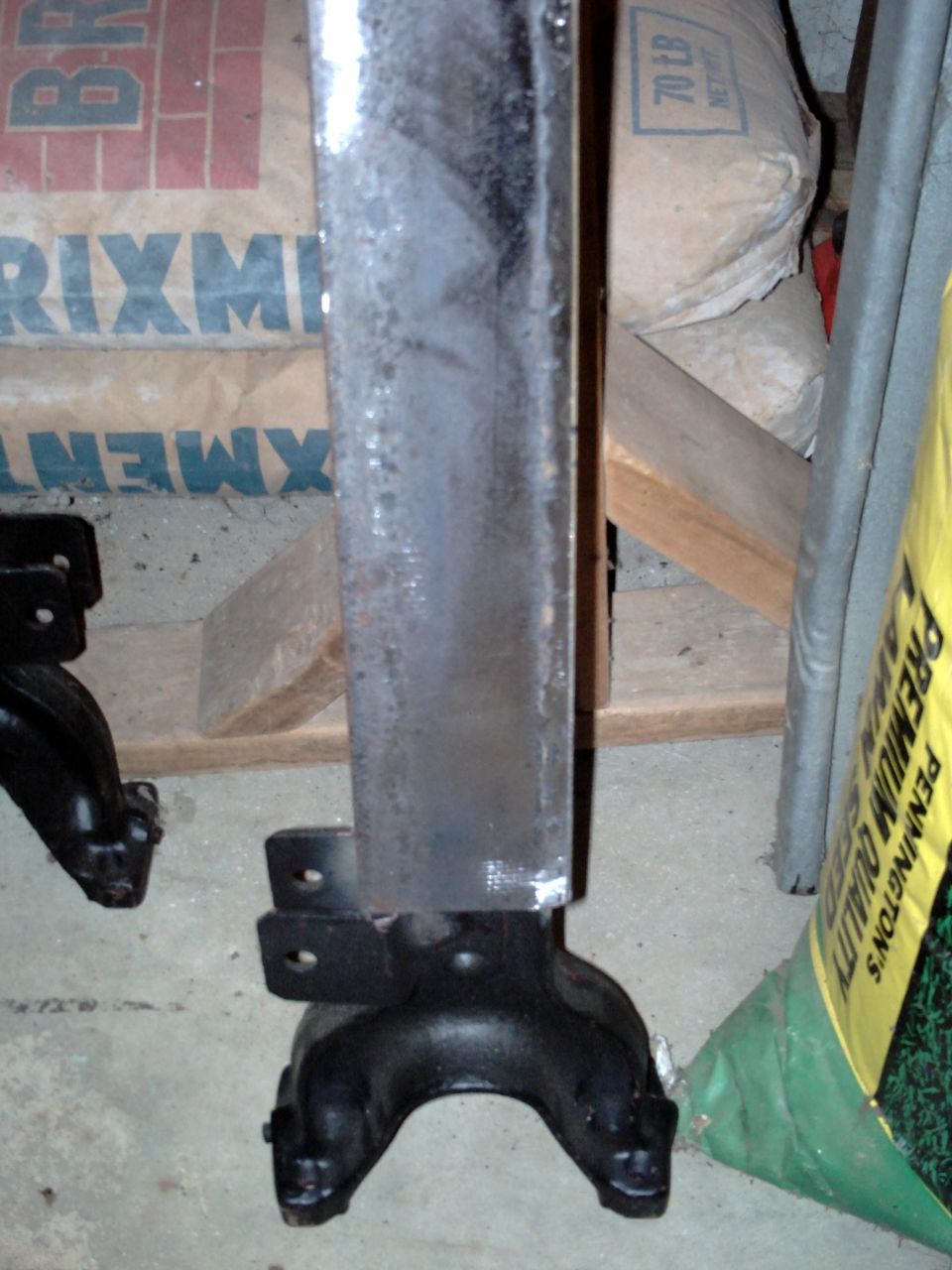 Close-up of a vehicle frame part with mounting brackets