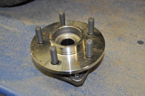 1996 Ford Bronco - Wheel hub assembly with five wheel studs shown close-up.