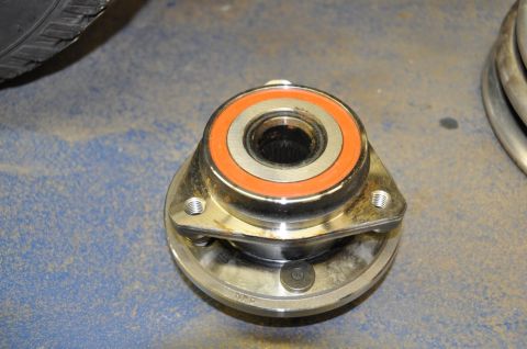 1996 Ford Bronco - A close-up view of a wheel hub assembly, showing its internal bearing and mounting flange.