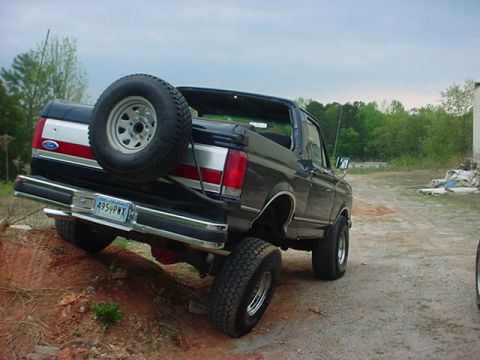 1989 Ford Bronco - This 1989 Ford Bronco is shown from the rear three-quarter angle, with its spare tire mounted on the tailgate.