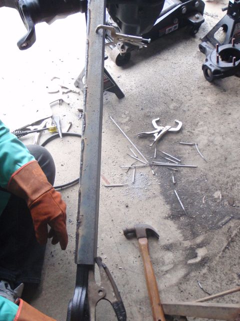 1996 Ford Bronco - A close-up view of welding equipment and tools on a concrete floor.