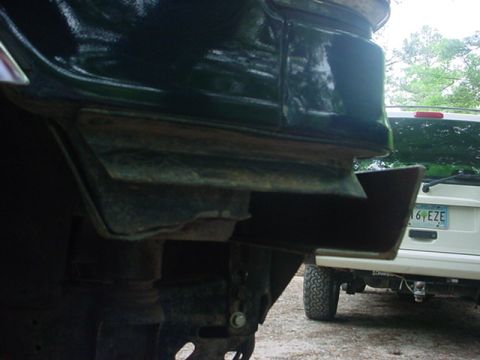 1989 Ford Bronco - Detail of vehicle undercarriage and rear bumper section.