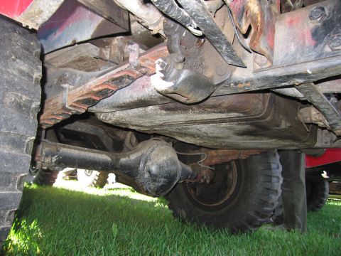 1991 Ford LTD Crown Victoria - Close-up of a truck's undercarriage, focusing on the rear axle and suspension components.