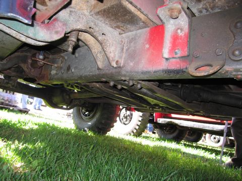1991 Ford LTD Crown Victoria - The undercarriage of a truck shows its frame, suspension components, and drivetrain parts.