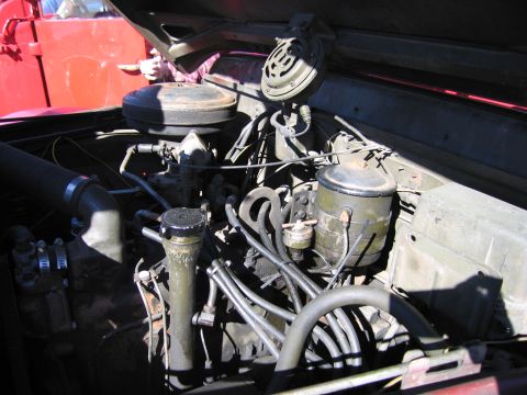 1991 Ford LTD Crown Victoria - Close-up view of the engine compartment, showing various mechanical components and wiring.