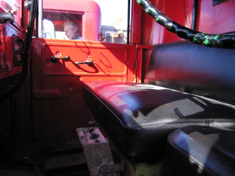 1991 Ford LTD Crown Victoria - Interior view of a red truck, showing the seats and door panel.