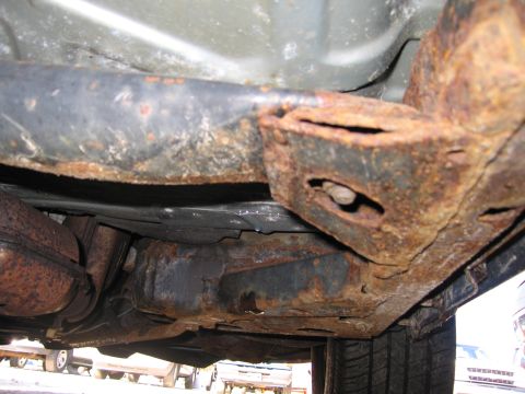 1991 Ford LTD Crown Victoria - Severe rust damage is visible on the undercarriage of this vehicle.