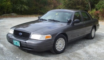 2003 Ford Crown Victoria - This 2003 Ford Crown Victoria sedan is shown from a three-quarter front view.