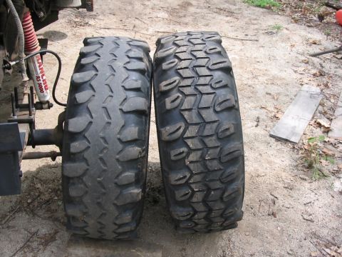 1985 Ford Bronco - Comparison of two distinct off-road tire tread patterns, highlighting differences in their design and wear.
