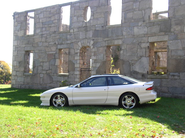 1996 Ford Probe GT parked by stone ruins