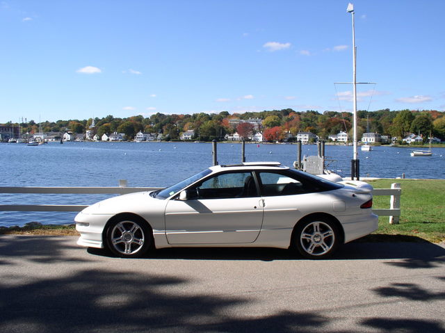 White 1996 Ford Probe GT side view parked by water