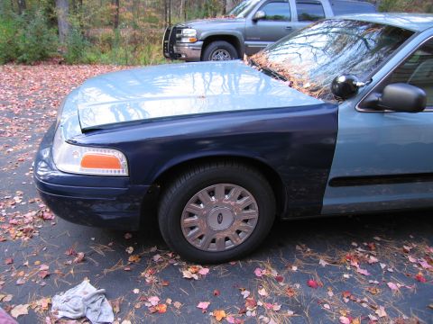 1991 Ford LTD Crown Victoria - Front 3/4 view of a 1991 Ford Crown Victoria LTD, showing the fender and door.