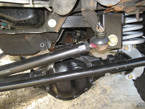 1996 Ford Bronco - Undercarriage view shows suspension and steering linkage components.