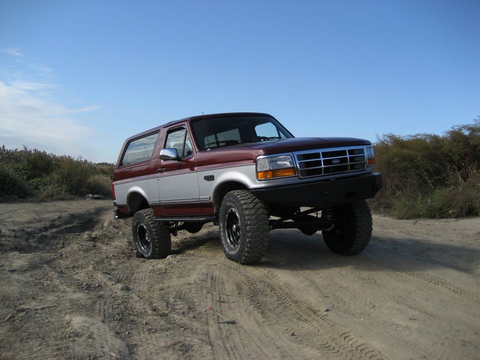 Ford Bronco on a dirt road, front quarter view