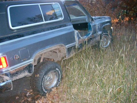 1988 Chevrolet Blazer - This 1988 Chevrolet Blazer appears to have had its doors removed and is parked off-road in tall grass.