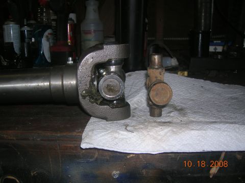 1985 Ford Bronco - comparision of u-joints...1350 on left, stock on right.