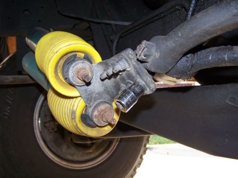 1986 Ford Bronco - Close-up view of the front suspension shock absorber assembly on a 1986 Ford Bronco.