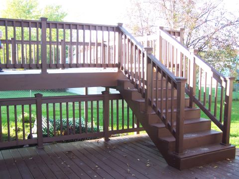 1986 Ford Bronco - Exterior view of a wooden deck and staircase on a sunny day.