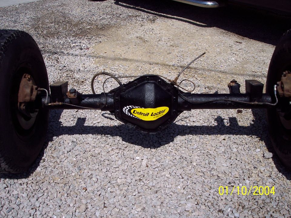 Rear axle assembly with Detroit Locker differential and tires, on gravel