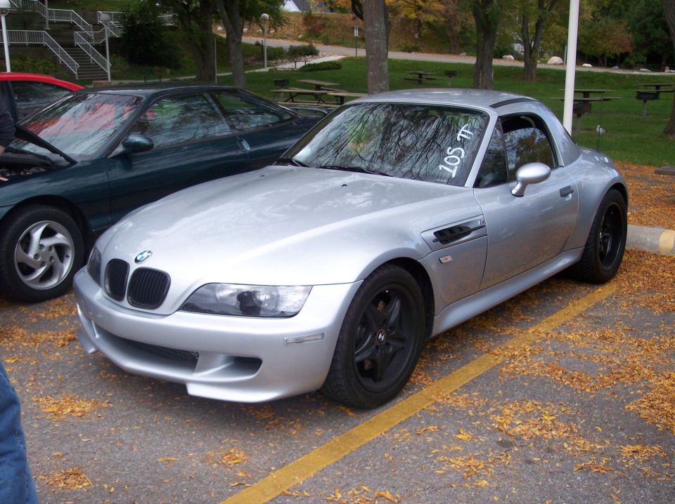 Silver BMW Z3 coupe with black wheels and a white windshield sticker.