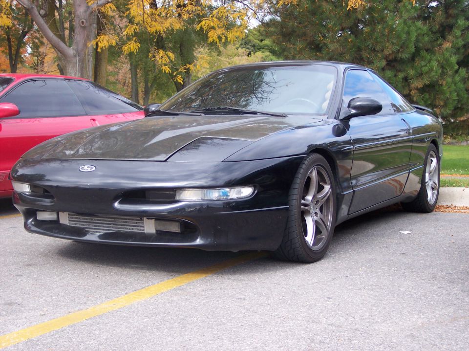 Black 1996 Ford Probe front 3/4 view with aftermarket intercooler and wheels